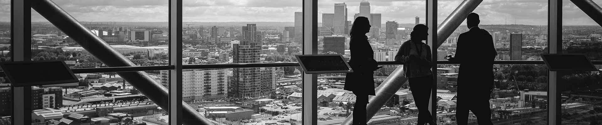 people with a view of a city in black and white