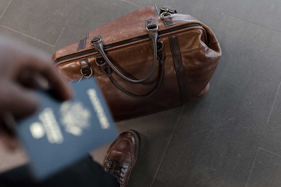 passport in front of a bag