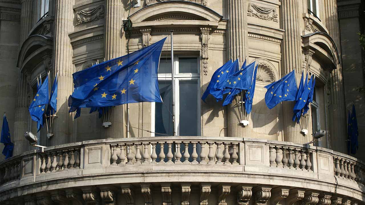 EU flags waving on a building