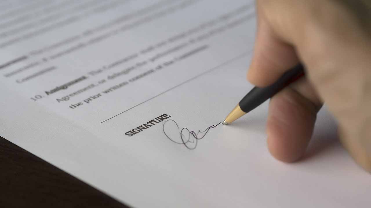 signing a paper