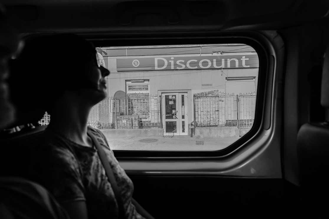 inside of a car in front of a shop